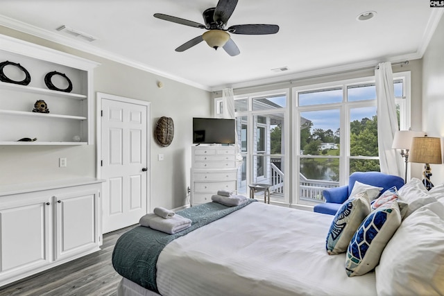 bedroom featuring ceiling fan, crown molding, and dark hardwood / wood-style floors