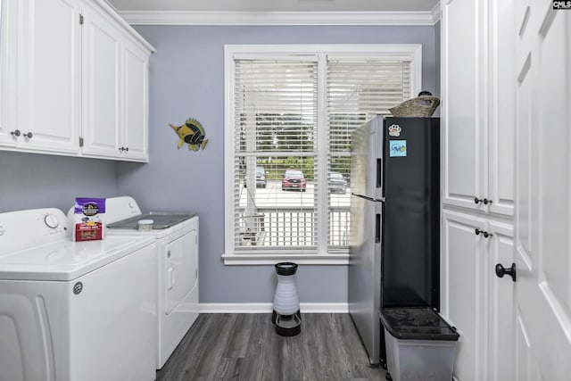 washroom with independent washer and dryer, cabinets, ornamental molding, and dark hardwood / wood-style flooring