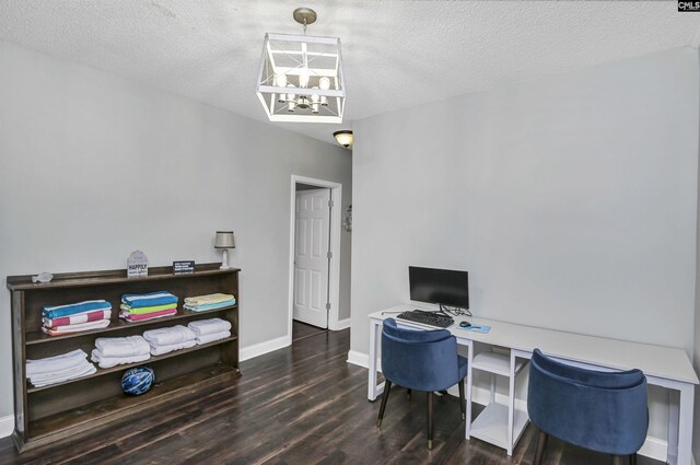 office with a textured ceiling and dark hardwood / wood-style floors