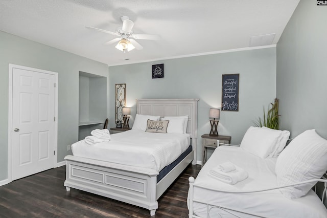 bedroom featuring a textured ceiling, ceiling fan, and dark hardwood / wood-style floors