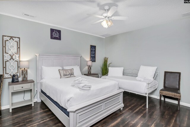 bedroom featuring a textured ceiling, ceiling fan, and dark hardwood / wood-style floors