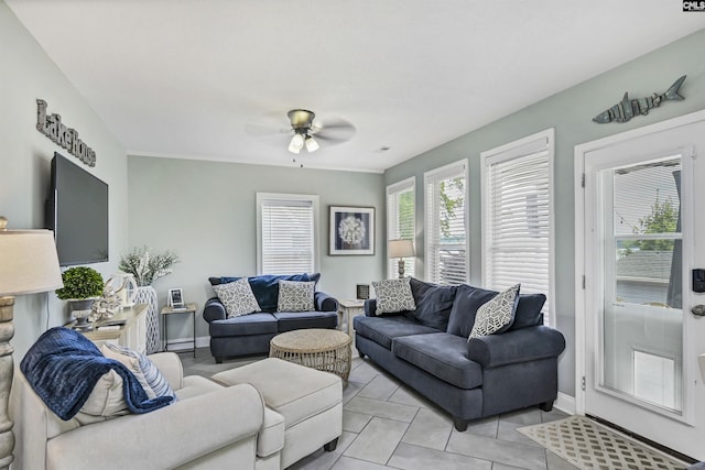 tiled living room with ceiling fan