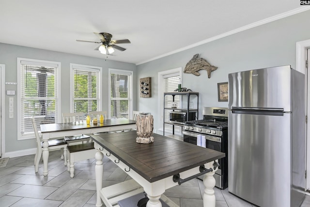 kitchen with light tile patterned floors, ceiling fan, plenty of natural light, and appliances with stainless steel finishes