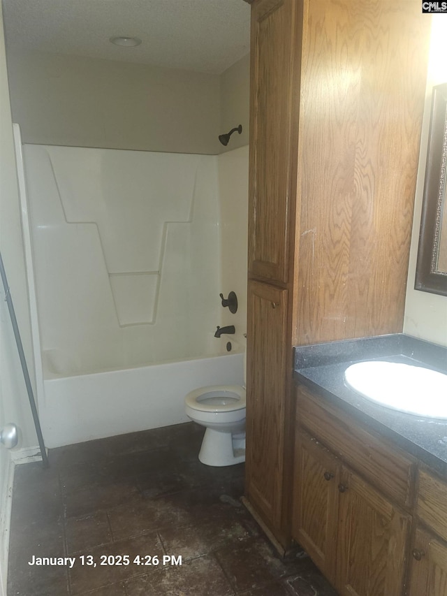 full bathroom with vanity, washtub / shower combination, and toilet