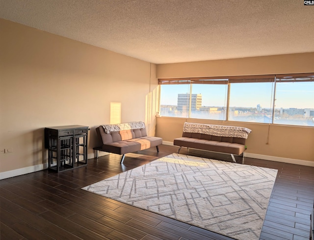 interior space featuring a textured ceiling and a water view