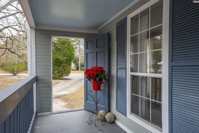 doorway to outside with crown molding and hardwood / wood-style flooring