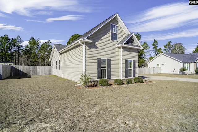 back of house with a lawn