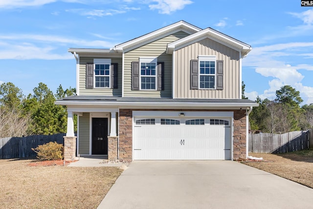 view of front facade featuring a garage and a front lawn