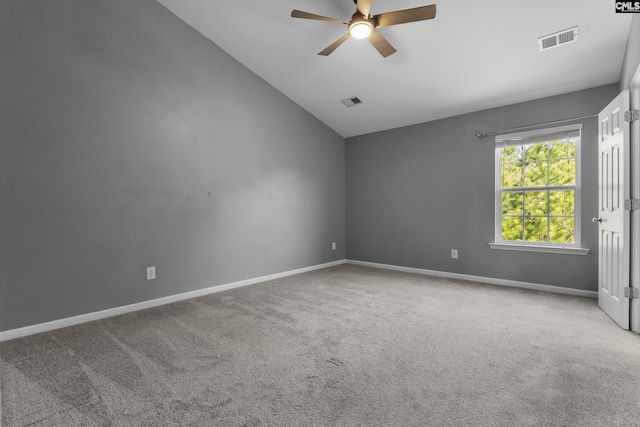 carpeted empty room featuring lofted ceiling and ceiling fan