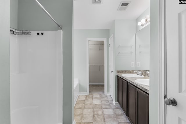 bathroom with separate shower and tub and vanity