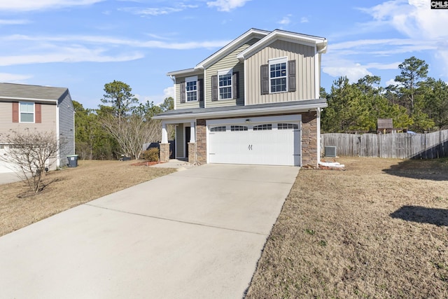 front of property featuring a front lawn and a garage