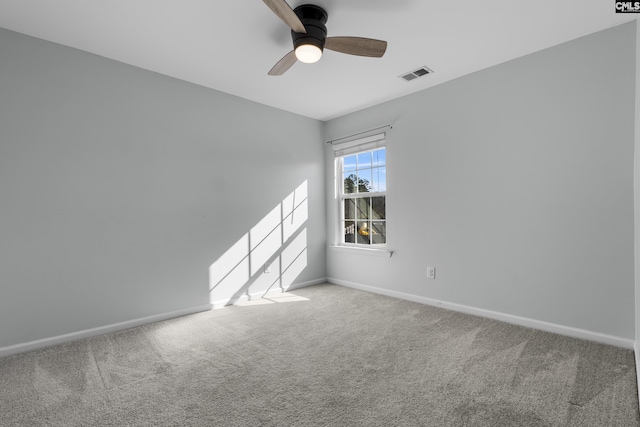 spare room with carpet floors and ceiling fan