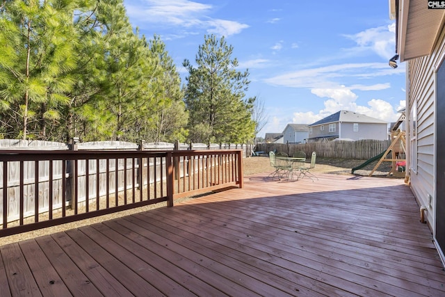 wooden deck with a playground