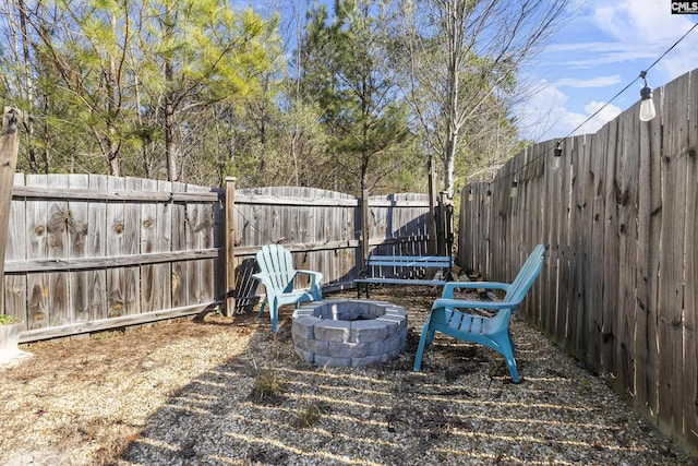 view of yard with an outdoor fire pit