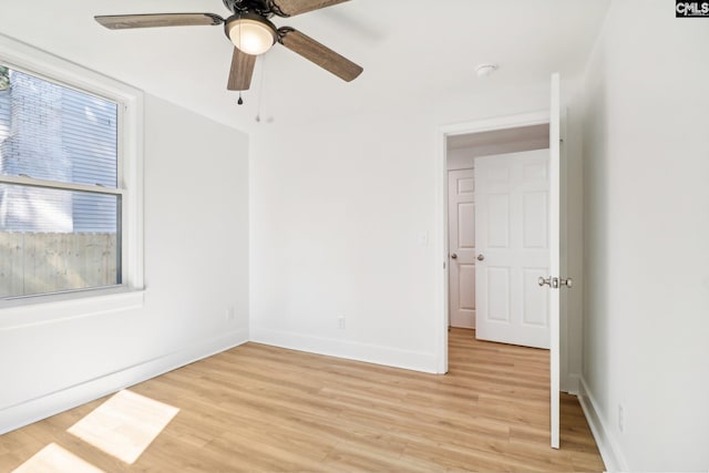 unfurnished room with ceiling fan and light wood-type flooring