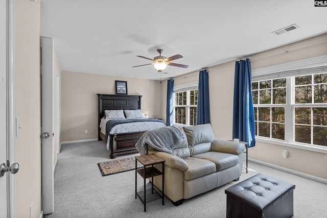 bedroom with light colored carpet and ceiling fan