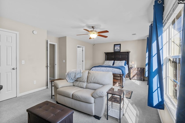 bedroom featuring light colored carpet and ceiling fan