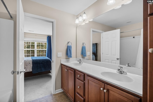 bathroom featuring tile patterned flooring and vanity