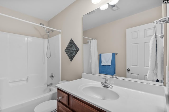 full bathroom with toilet, shower / tub combo, and vanity