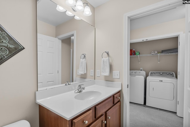 bathroom with vanity and independent washer and dryer