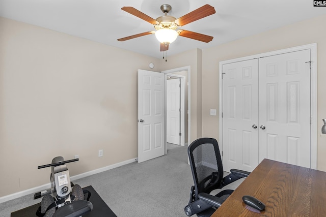 office space featuring ceiling fan and light carpet