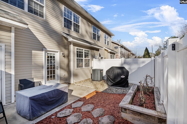 view of patio featuring central AC and a grill