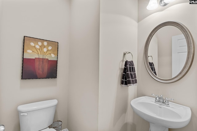 bathroom featuring sink and toilet