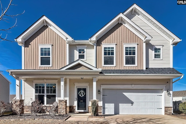 view of front of property featuring a porch and a garage