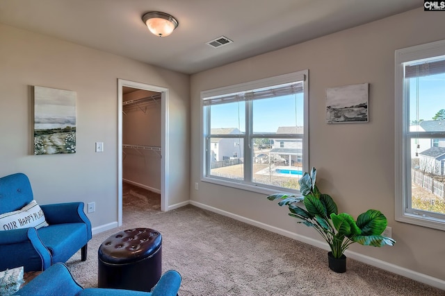 living area featuring carpet flooring