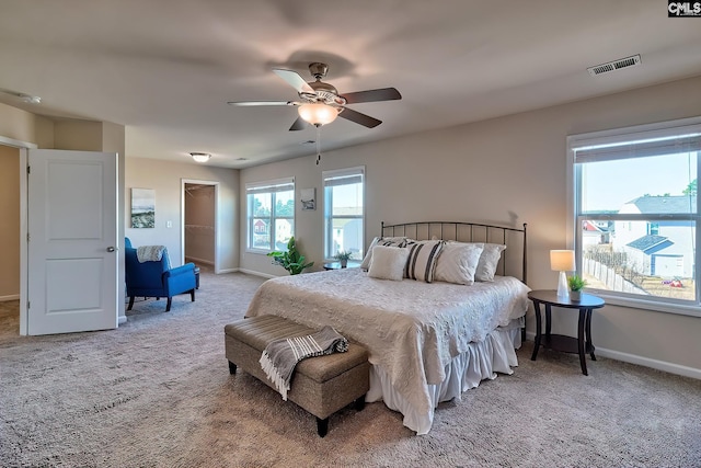 bedroom with ceiling fan and carpet floors