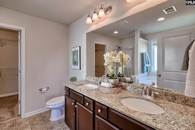 full bathroom with toilet, shower with separate bathtub, vanity, and tile patterned flooring