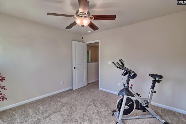 workout area with ceiling fan and carpet floors