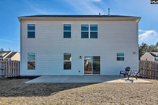 rear view of house featuring a patio area