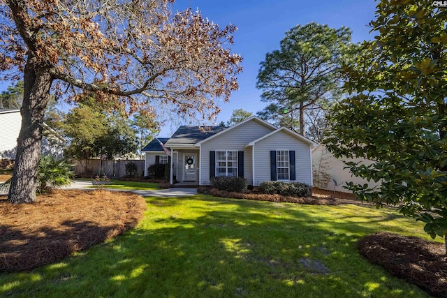 single story home featuring a front yard