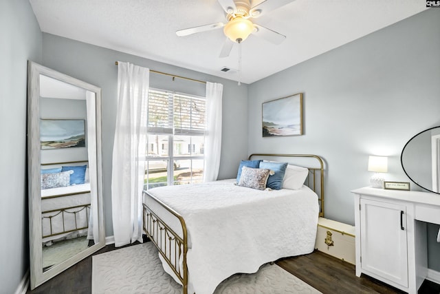 bedroom featuring ceiling fan and dark hardwood / wood-style flooring