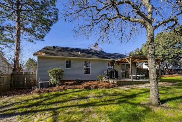 back of house with a pergola, a deck, a yard, and central AC unit