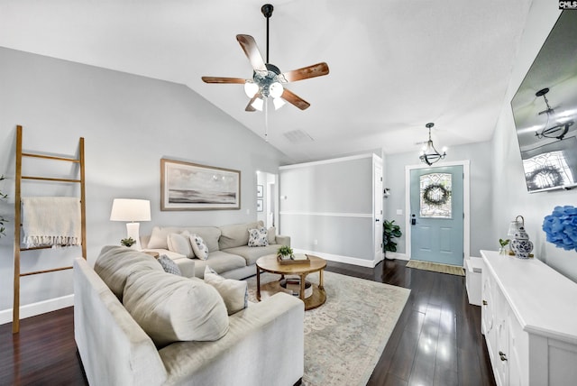 living room with ceiling fan, dark hardwood / wood-style flooring, and vaulted ceiling