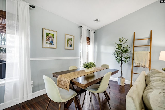 dining area with dark wood-type flooring