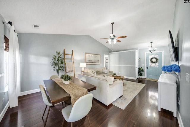 living room featuring ceiling fan, vaulted ceiling, and dark hardwood / wood-style floors