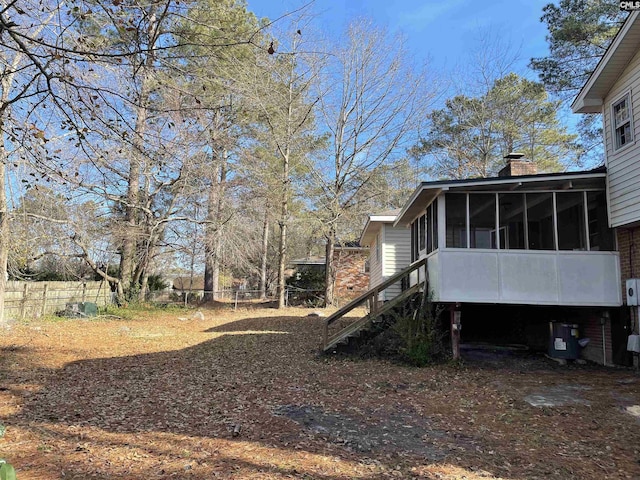 view of yard with a sunroom