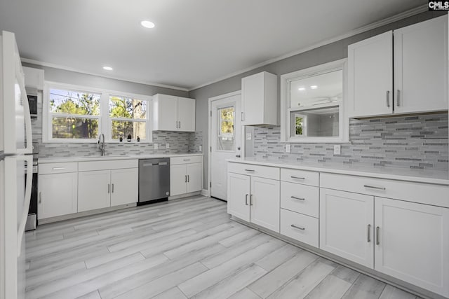 kitchen with sink, stainless steel dishwasher, and white cabinetry