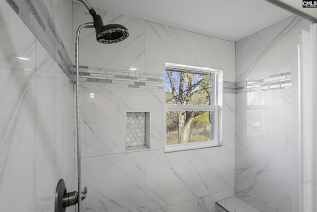 bathroom featuring tiled shower