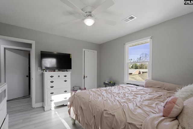 bedroom featuring ceiling fan and light hardwood / wood-style floors