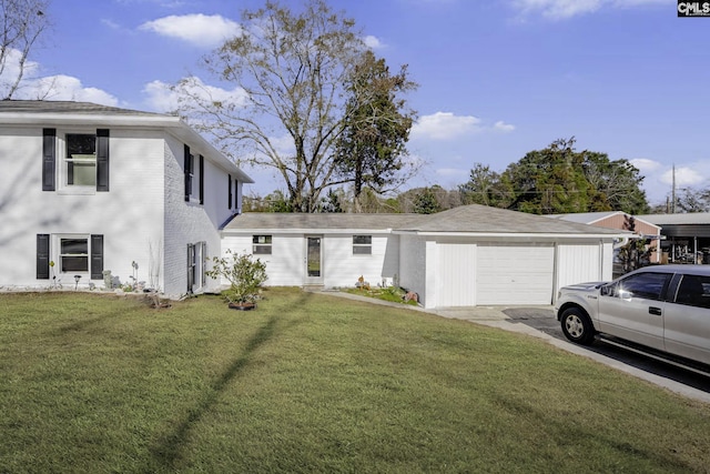 view of front facade with a front yard and a garage