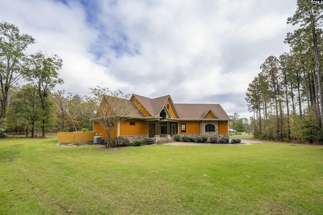 craftsman inspired home with a front yard and central AC unit