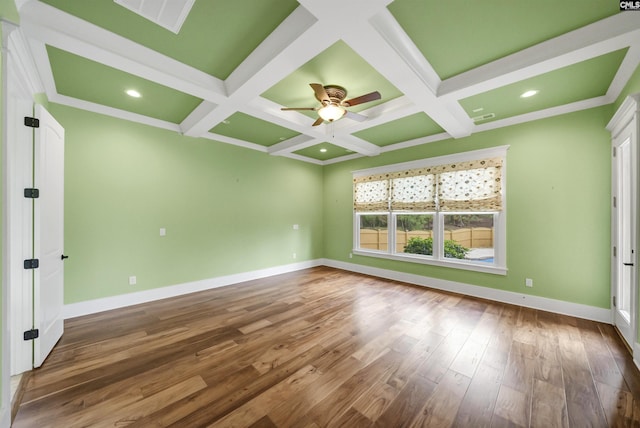 spare room with coffered ceiling, ceiling fan, hardwood / wood-style flooring, and beam ceiling