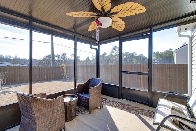 sunroom with ceiling fan and a wealth of natural light