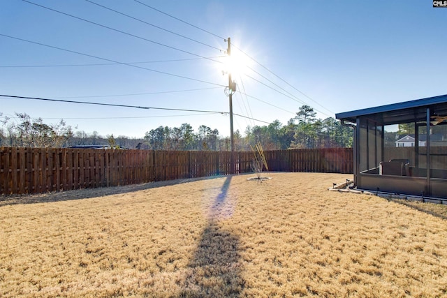 view of yard with a sunroom