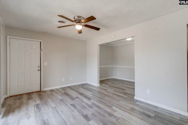 unfurnished room with light wood-type flooring, ceiling fan, and a textured ceiling