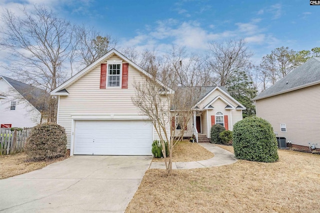 front of property featuring a garage and central air condition unit